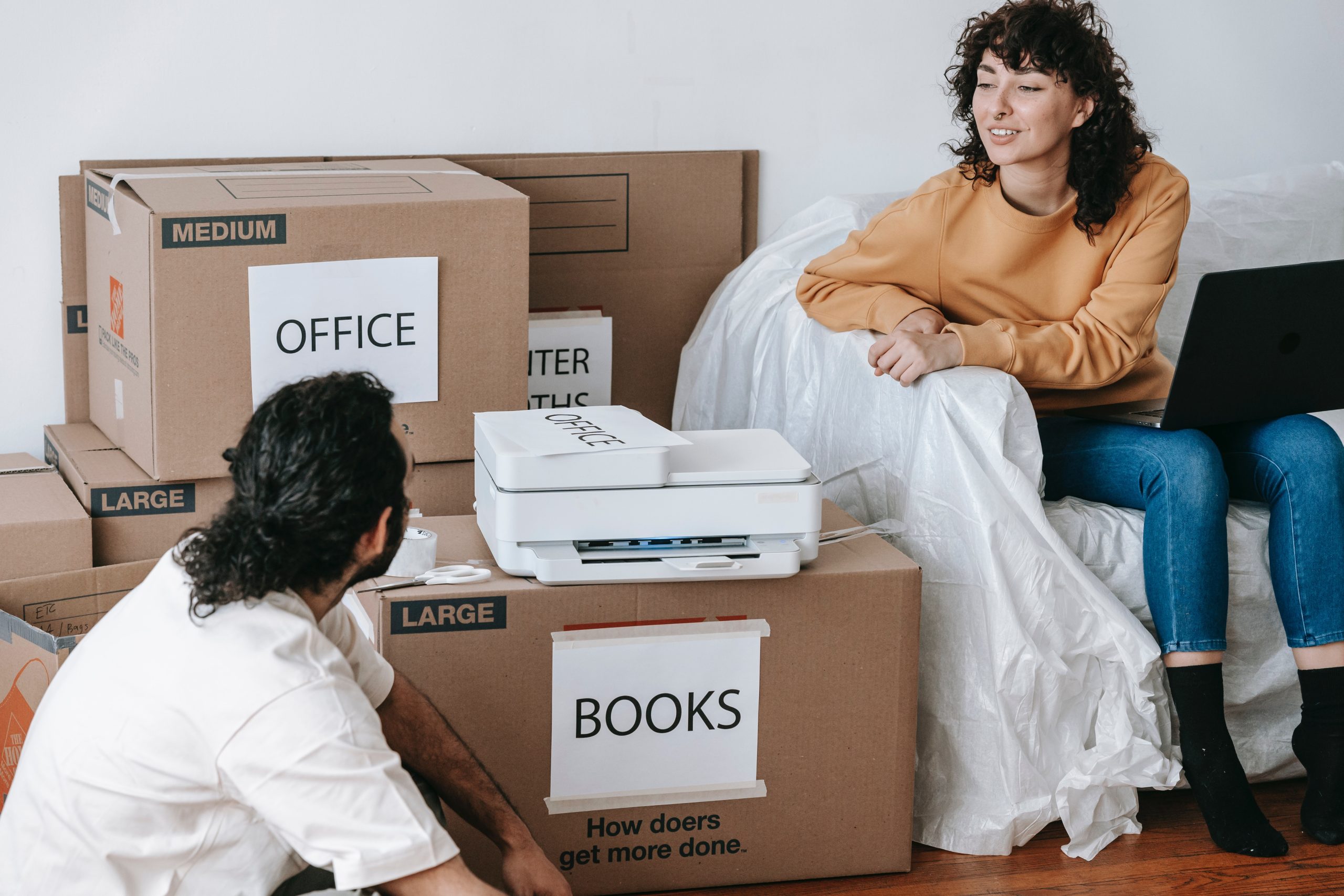 Family happy after packing and labeling their stuff and ready for moving