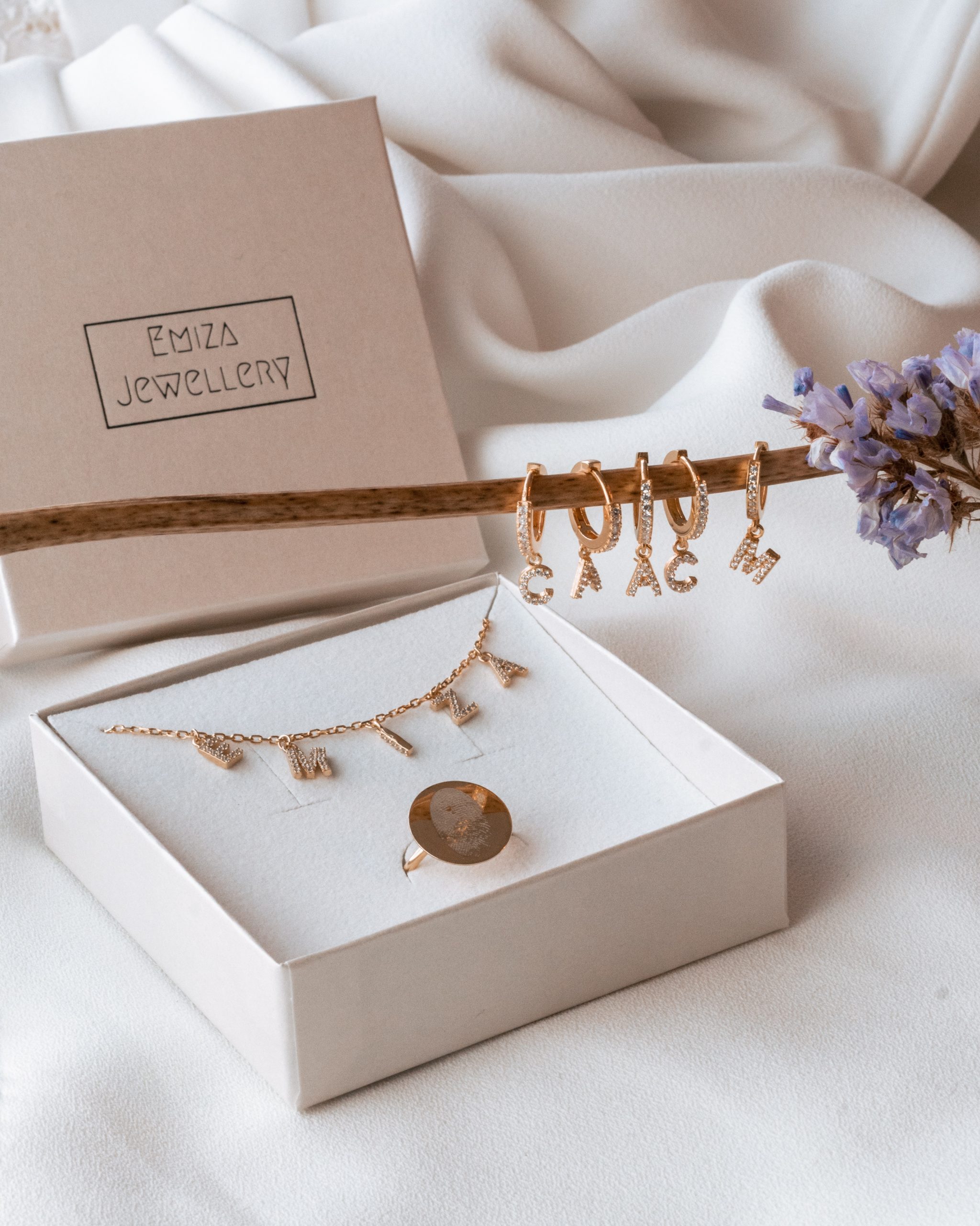 Hand holding jewelry box and important documents.