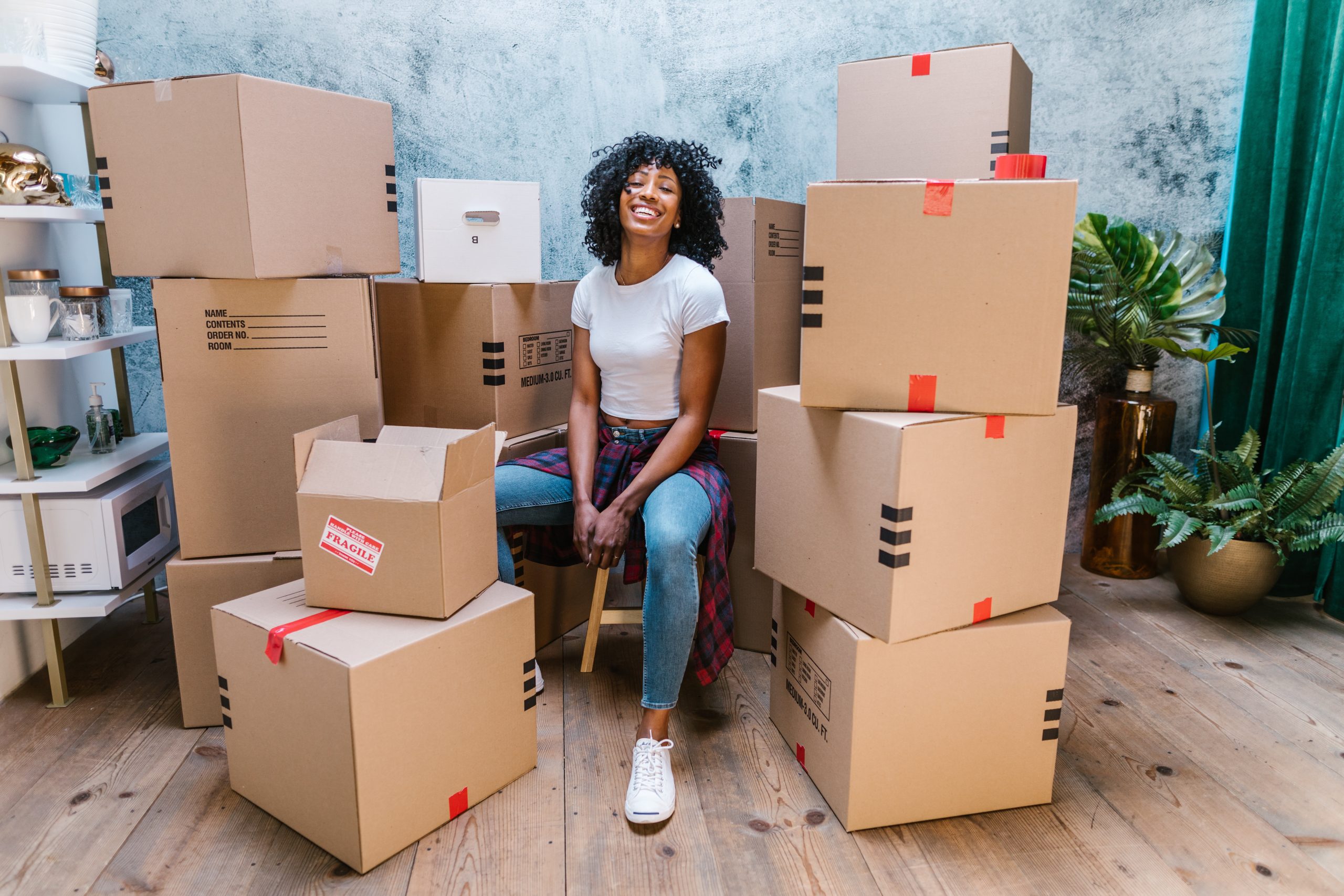 A woman happy after her packing and ready to move