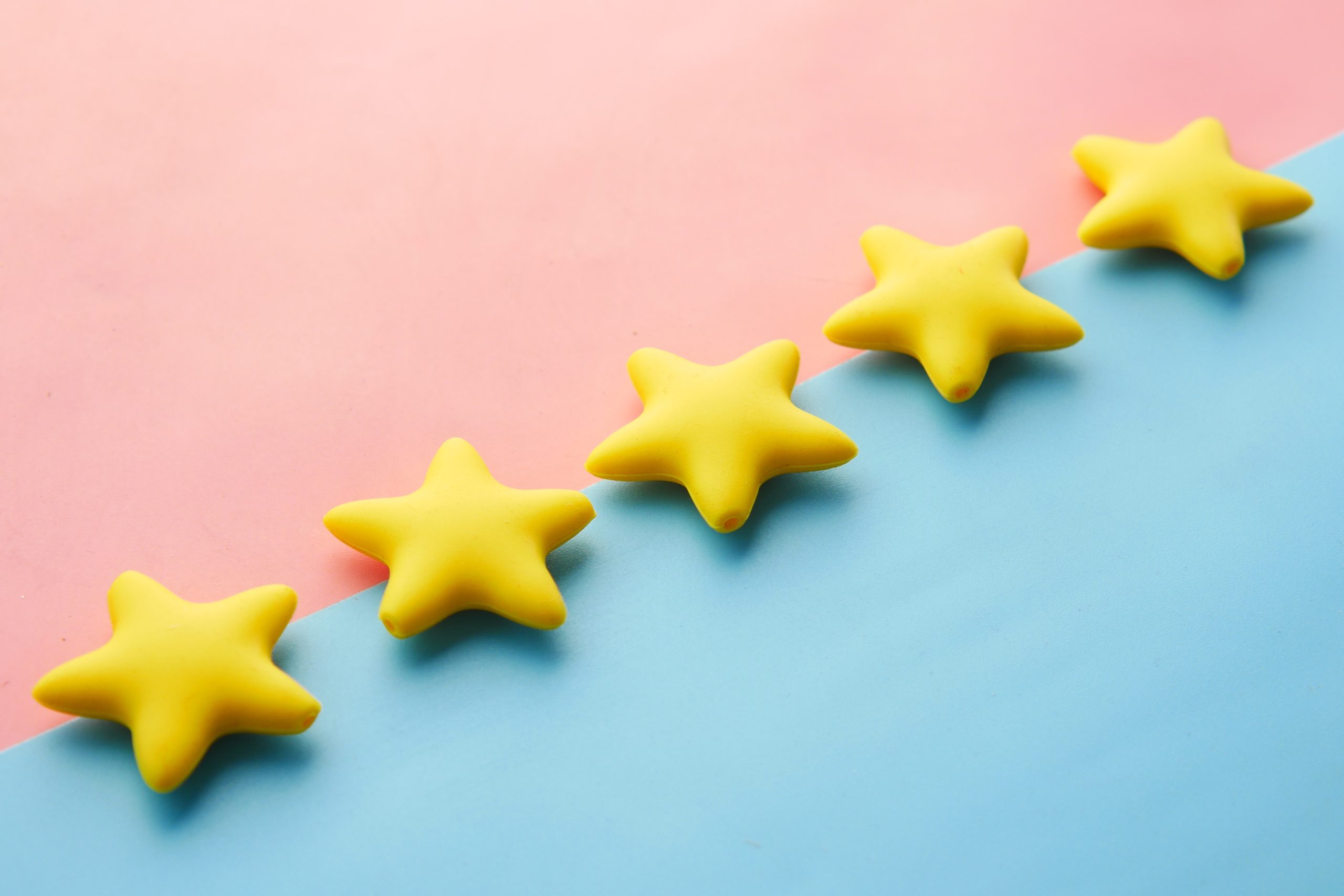 Five Stars shown on pink and blue background