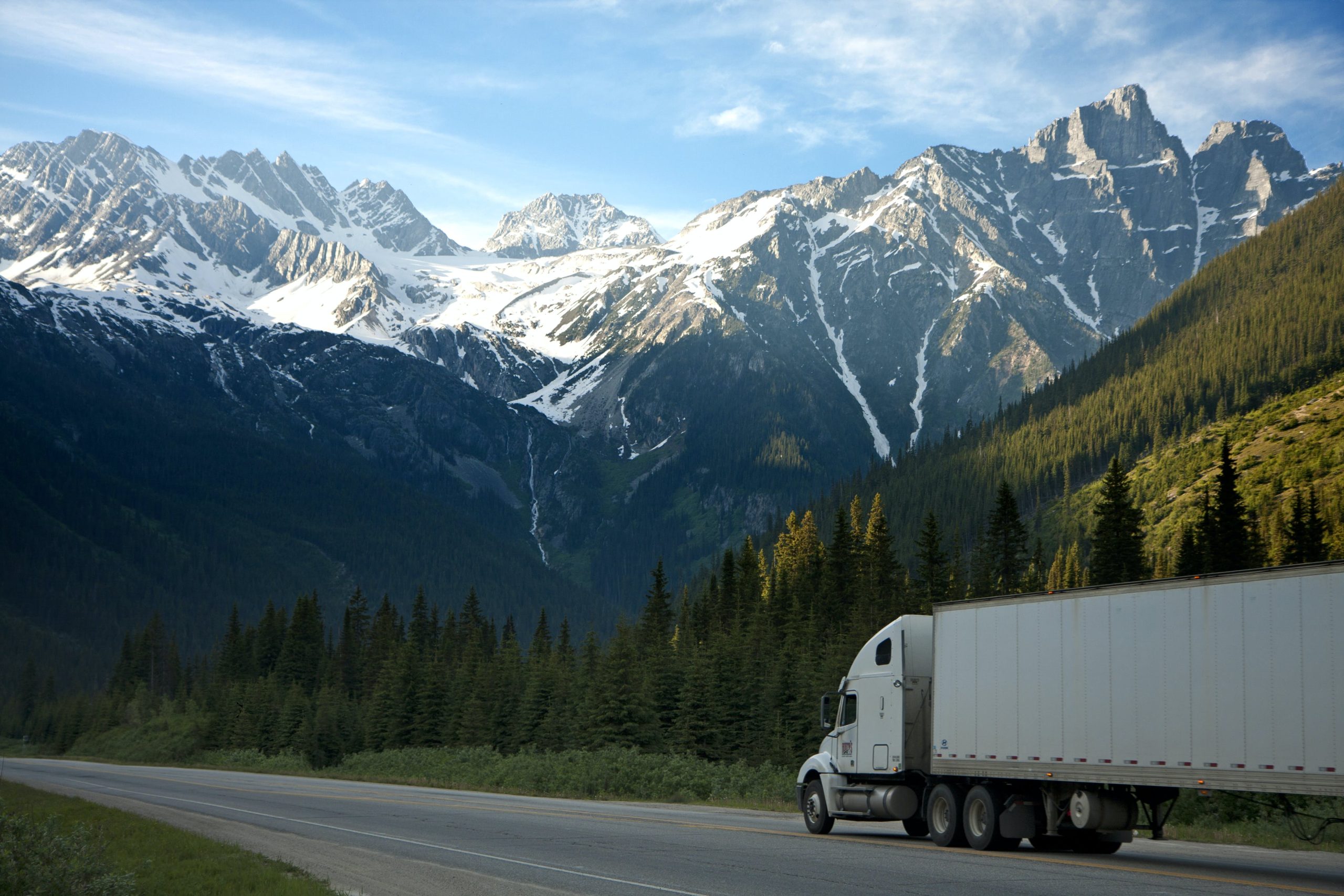 Moving truck against stunning Canadian landscapes - representing local and long-distance moves in Canada
