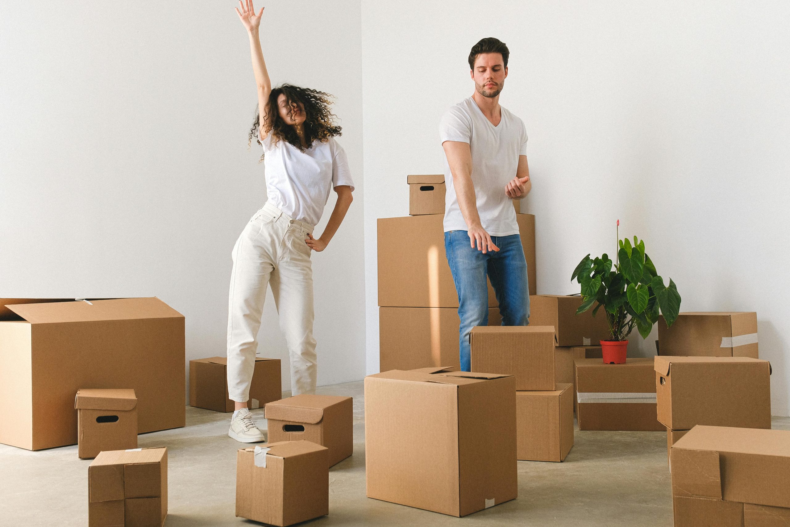 "The image of a family unpacking in their new home: "Moving Company Selection: Happy family settling into new residence"