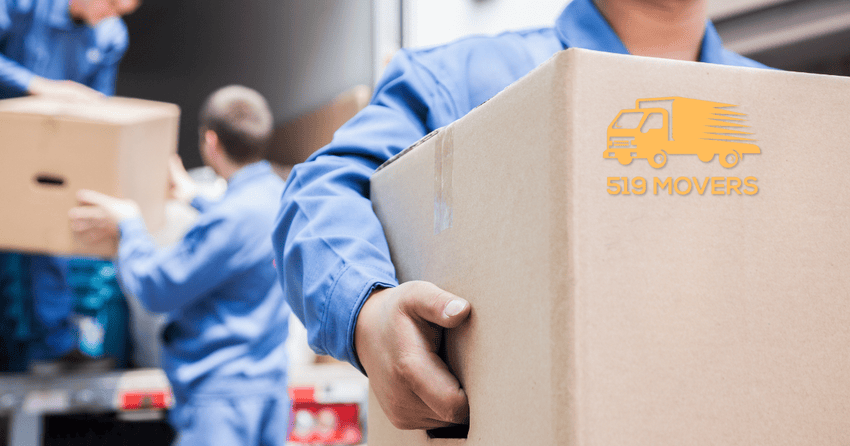Professional movers unloading boxes.