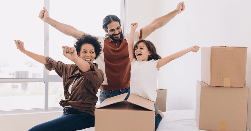 A family of three happy and excited about moving.