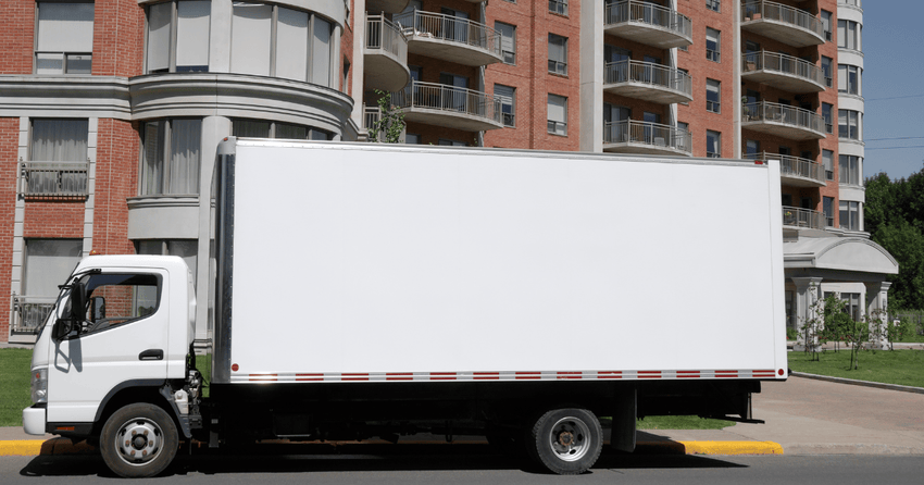 Moving truck parked outside an apartment building in London, Ontario.